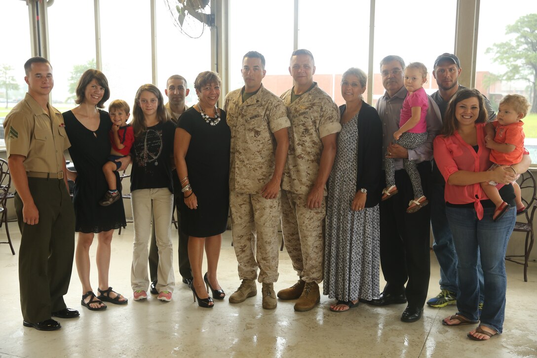 The family of Cpl. Robert Robles gathers for a photo after Robles’ promotion ceremony at Marine Corps Air Station Cherry Point, N.C., Aug. 5, 2014. Lt. Col. Ernest Henderson, Robles’ uncle, acted as the promoting officer during the ceremony, his last official duty before retirement. Robles is a third-generation Marine with a family history of Marine Corps service stretching back to the 1950s. Robles is a military policeman with Cherry Point’s Provost Marshals Office. 
