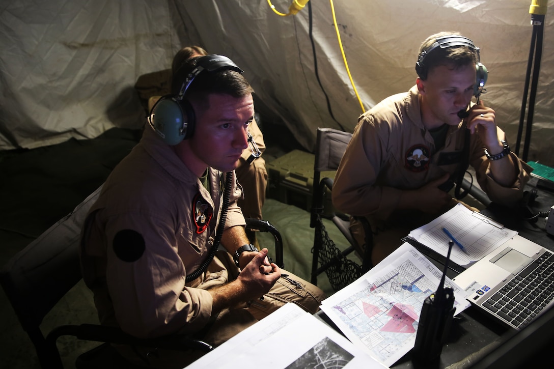Second Lt. Orlando J. Benedict, left, and Capt. Jonathan C. Putney navigate RQ- 7B Shadow unmanned aerial vehicle during training at Avon Park Air Force Range, Fla., Aug. 4, 2014. Both Benedict and Putney are unmanned aerial vehicle commanders with Marine Unmanned Aerial Vehicle Squadron 2. Benedict is native of Grand Blanc, Mich., and Putney is a Naples, Fla., native.