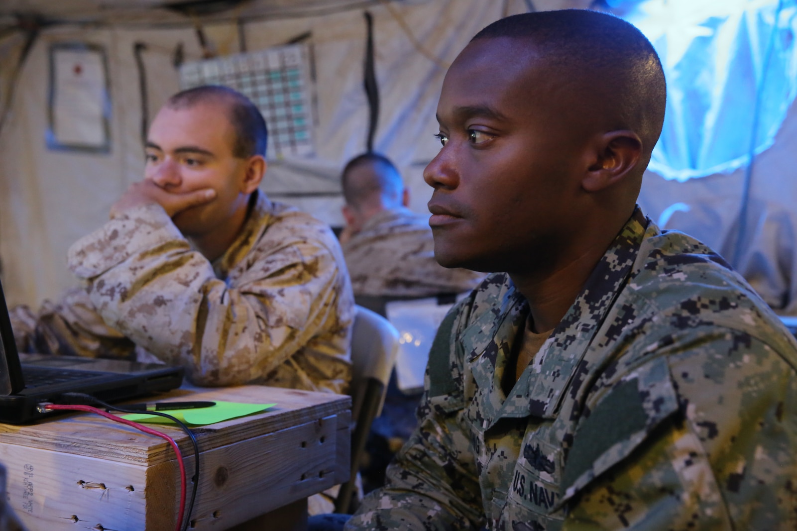 Navy Lt. Cmdr. Jonathan Long, right, representing the fires officer of the Expeditionary Strike Group 3, and Cpl. Charles Stephens, a command control communications computer specialist with 1st Marine Expeditionary Brigade, practice coordinating fire missions during Large Scale Exercise 2014 here, Aug. 10, 2014. LSE-14 is a bilateral training exercise being conducted by 1st MEB to build U.S. and Canadian forces’ joint capabilities through live, simulated, and constructive military training activities. The exercise also promotes interoperability and cooperation between joint, coalition, and U.S. Marine Forces, providing the opportunity to exchange knowledge and learn from each other, establish personal and professional relationships and hone individual and small-unit skills through challenging, complex and realistic live scenarios with special focus on building combat power ashore.
