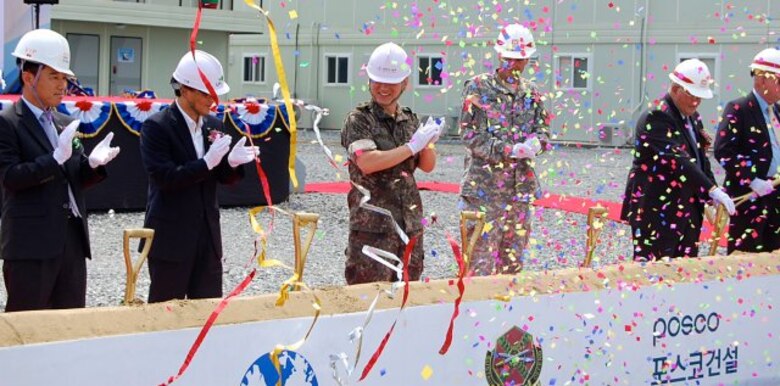 Ground was broken for the new "downtown" area, featuring a new Exchange, commissary and bowling center among other facilities, at Camp Humphreys, South Korea, Aug. 11, 2014. The project will also see the construction of an auditorium, chapel, chapel family life center, an arts & crafts center, recreation center, plaza and parking. When completed, these facilities will provide retail shopping, groceries, entertainment, recreation and religious services.