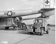 C-119 31 Jan 1961 - 19 Dec 1962; Ground Power Unit Being Loaded Onto C-119; Left to Right, #1 Unk, #2 Unk, #3 Unk, #4 Unk, #5 Unk (Photo by NCANG Heritage Program)