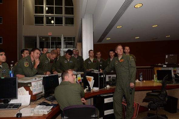 Aircrews from the 2nd Bomb Wing, Barksdale Air Force Base, La., attend a step brief at Ellsworth Air Force Base, S.D., Aug. 11, 2014. Following the brief, a B-52H Stratofortress and seven-person crew from Barksdale’s 96th Bomb Squadron, flew a nonstop, 15.5-hour round-trip intelligence, surveillance and reconnaissance mission from the United States to the U.S. Southern Command area of operations as part of PANAMAX 2014, an annual, U.S. Southern Command-sponsored multinational exercise. PANAMAX 2014 is designed to develop and test participating nations' capabilities to respond and support a wide variety of air, land, sea, space and cyber missions as a unified force. For Air Force Global Strike Command, PANAMAX was an opportunity to familiarize aircrews with the U.S. Southern Command region and train in a unique mission set not normally associated with bomber operations. “The B-52 can be modified with additional equipment that allows it to be an especially valuable ISR platform because of its ability to conduct long-range surveillance flights,” said Lt. Col. Robert Bender, chief of AFGSC's Current Operations Branch. “PANAMAX is an excellent opportunity for our aircrews to exercise these capabilities in an operational training environment.” (U.S. Air Force photo by Airman 1st Class Rebecca Imwalle/ Released)