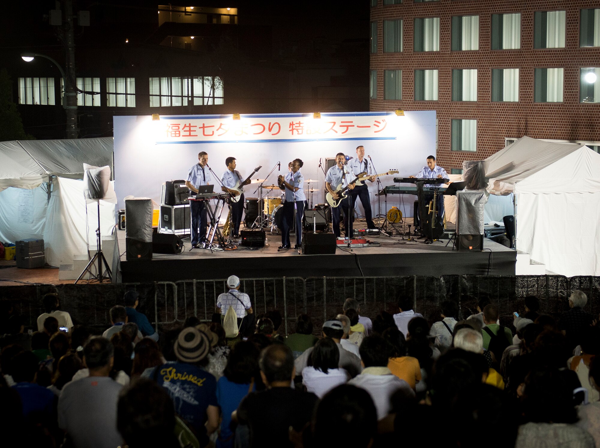 The Air Force Band of the Pacific performs at Fussa City Hall during the Fussa Tanabata Festival in Fussa City, Japan, Aug. 8, 2013. The festival included several parades as well as street vendors selling a variety of traditional Japanese festival foods. (U.S. Air Force photo by Airman 1st Class Meagan Schutter/Released)