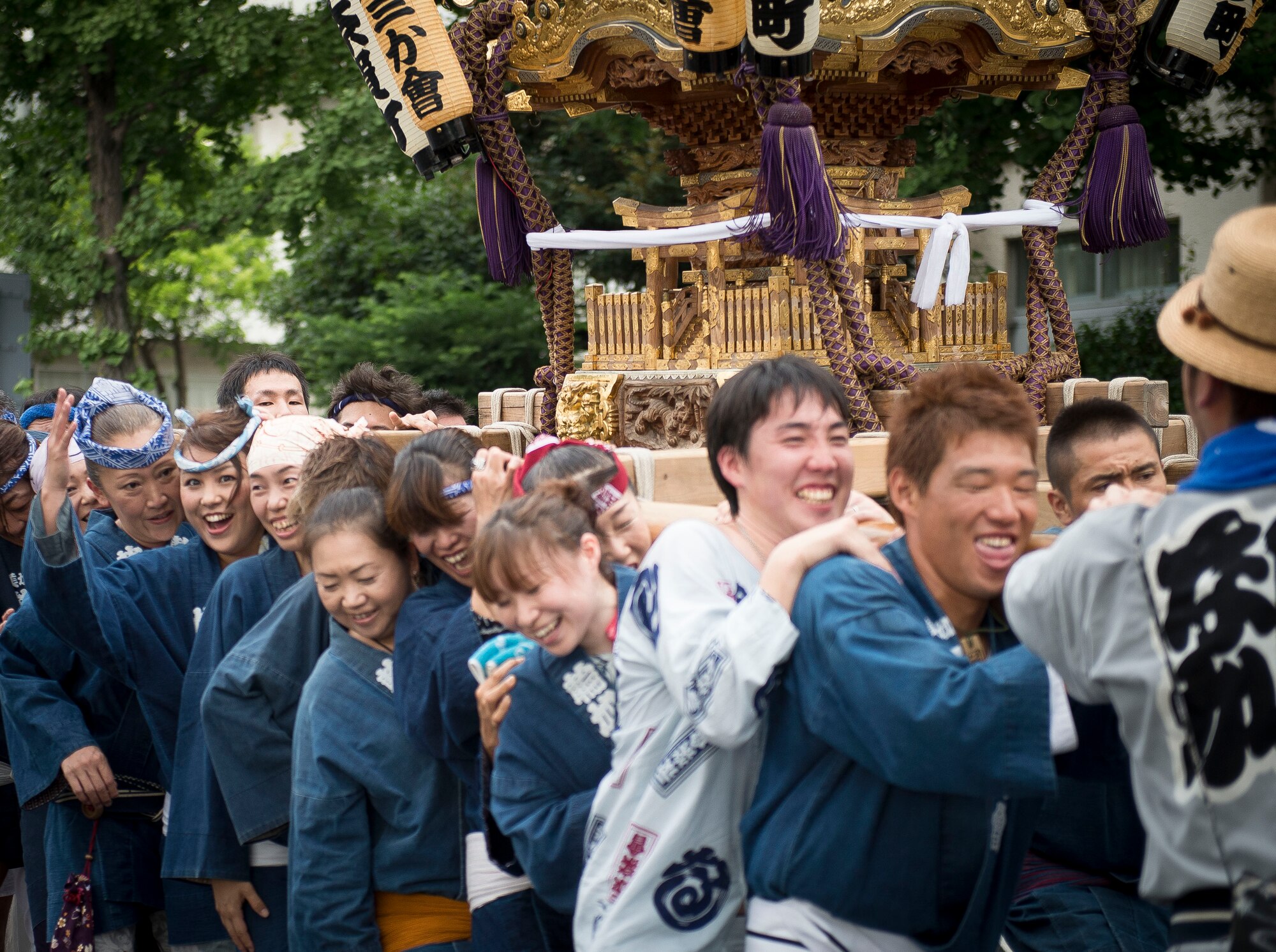 Local residents carry a mikoshi shrine in Fussa City, Japan, Aug. 8, 2013, during the 64th annual Fussa Tanabata Festival. The festival included traditional Japanese dance performances and groups carrying mikoshi shrines from Shinmeisya Shrine to Fussa City Hall. (U.S. Air Force photo by Airman 1st Class Meagan Schutter/Released)