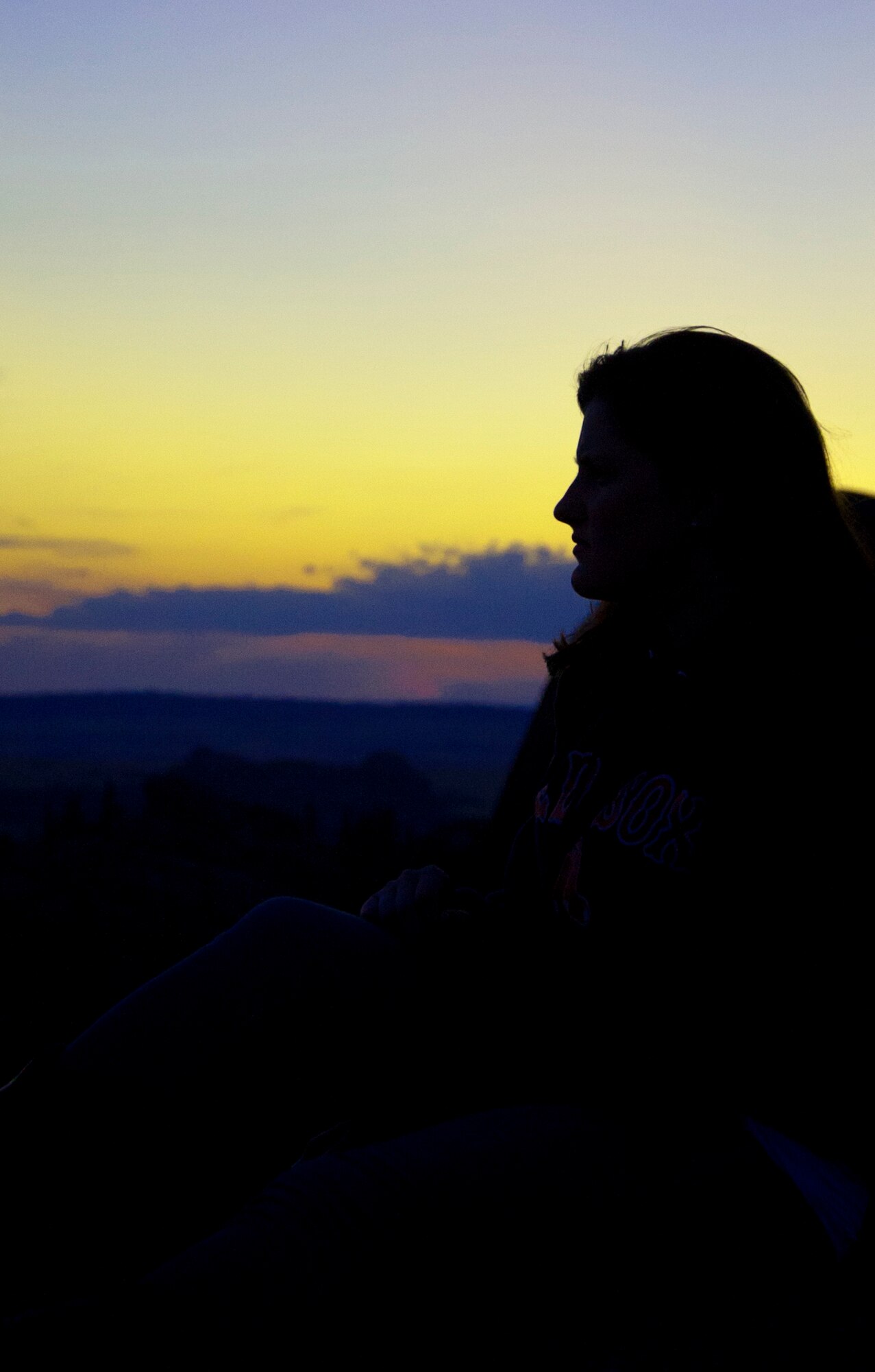 140810-F-GZ967-015 Airman 1st Class Siobhan Lynch, 90th Medical Group, takes in the view Aug. 10 as the sun sets over Vedauwoo State Park. As the sun sets, Vedauwoo becomes a great place to view the stars over the Wyoming sky. (U.S. Air Force photo by Airman 1st Class Brandon Valle)