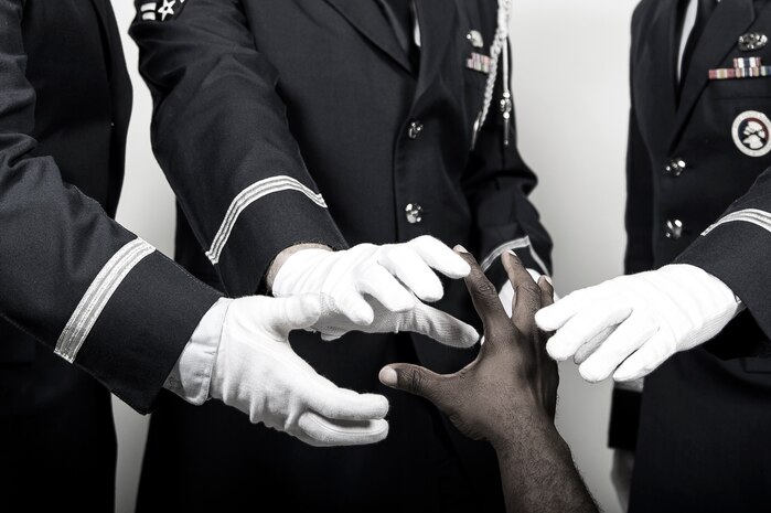 Senior Airman Kendall Johnson, Senior Airman Joshua Kilburn and Airman 1st Class Michael Reeves, Joint Base Charleston honor guardsmen, pose for a photo, Aug. 7, 2014, at Joint Base Charleston, S.C. The three members of the JB Charleston Honor Guard responded to a crisis where a fellow team member was in need of help. (U.S. Air Force photo/Senior Airman George Goslin)