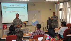 Col. Brad Hoagland, 11th Wing/Joint Base Andrews’ commander, expresses the importance of the spouse’s role in the military during a Heart Link event at the Military & Family Support Center here, August 9, 2014. (U.S. Air Force photo/Airman 1st Class Ryan J. Sonnier)