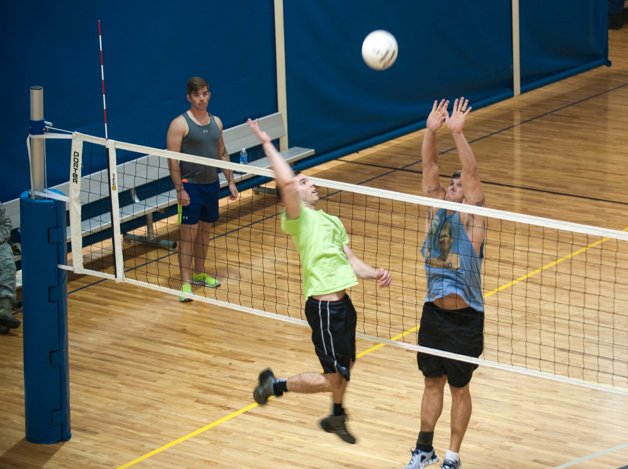 Cory Hebb, right, from Team Reapers, attempts to block a spike from James Hess, Team Money, during a volleyball tournament at Moody Air Force Base, Ga., Aug. 8, 2014.  Team Reapers ultimately won the tournament, beating the other three teams in the double-elimination style tournament. (U.S. Air Force photo by Senior Airman Jarrod Grammel/Released)
