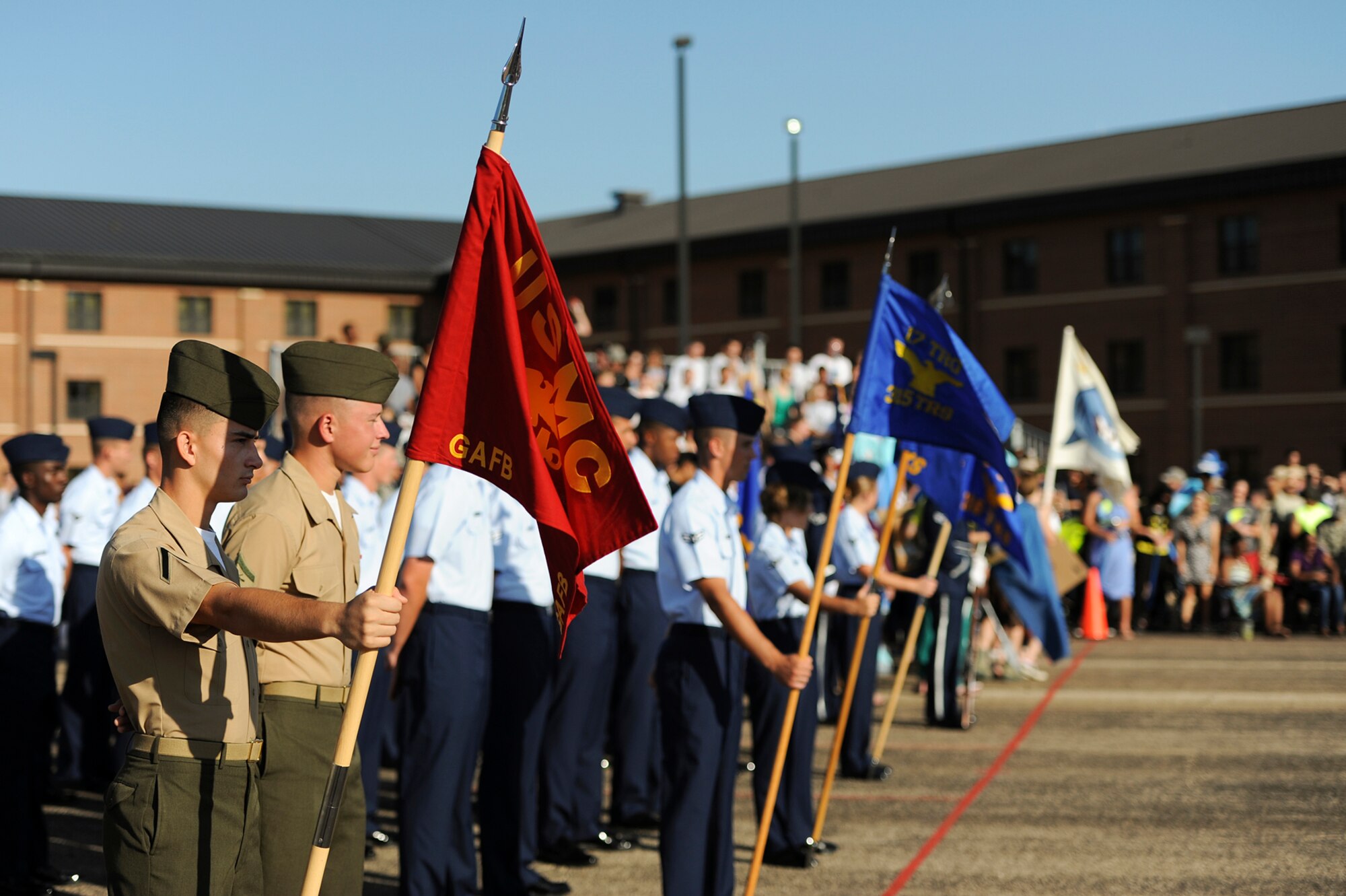 GOODFELLOW AIR FORCE BASE, Texas -- The Marine Corps Detachment and the 17th Training Group squadrons prepare for the third quarter drill competition on the flight line Aug. 9. The competition consisted of five different categories; open ranks, regulation, individual, exhibition and spirit. (U.S. Air Force photo/ Airman 1st Class Devin Boyer)