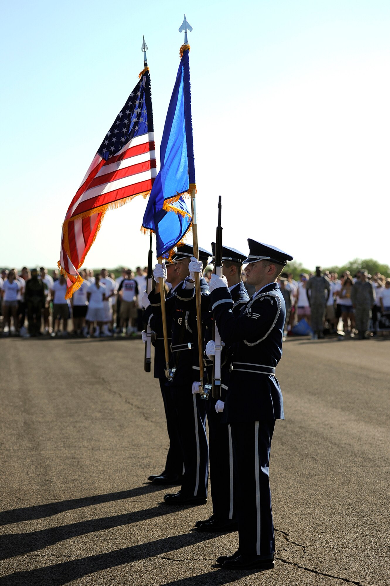 GOODFELLOW AIR FORCE BASE, Texas – The base honor guard prepare to present arms during the third quarter drill competition on the flight line Aug. 9. During the presentation of the colors, Goodfellow’s Patriotic Blue kicked off the drill competition with the singing of the national anthem. (U.S. Air Force photo/ Airman 1st Class Devin Boyer)