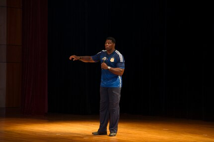Heisman Trophy winner and former NFL star Herschel Walker shares his story about growing up in Georgia, playing professional football and how he sought help from mental health professionals for his struggles with dissociative identity disorder at the Air Base Theater, Aug. 6, 2014, at Joint Base Charleston, S.C. Walker also held a meet and greet at both the Weapons Station and Air Base where he met with service members and their families and signed autographs. Walker played college football at the University of Georgia and spent 14 years in the NFL. (U.S. Air Force photo/Staff Sgt. William O’Brien)