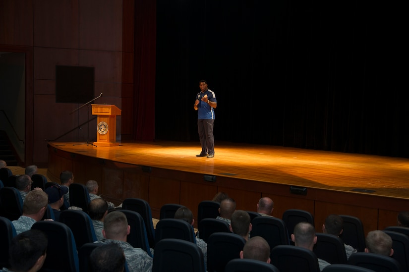 Heisman Trophy winner and former NFL star Herschel Walker shares his story about growing up in Georgia, playing professional football and how he sought help from mental health professionals for his struggles with dissociative identity disorder at the Air Base Theater, Aug. 6, 2014, at Joint Base Charleston, S.C. Walker also held a meet and greet at both the Weapons Station and Air Base where he met with service members and their families and signed autographs. Walker played college football at the University of Georgia and spent 14 years in the NFL. (U.S. Air Force photo/Staff Sgt. William O’Brien)    