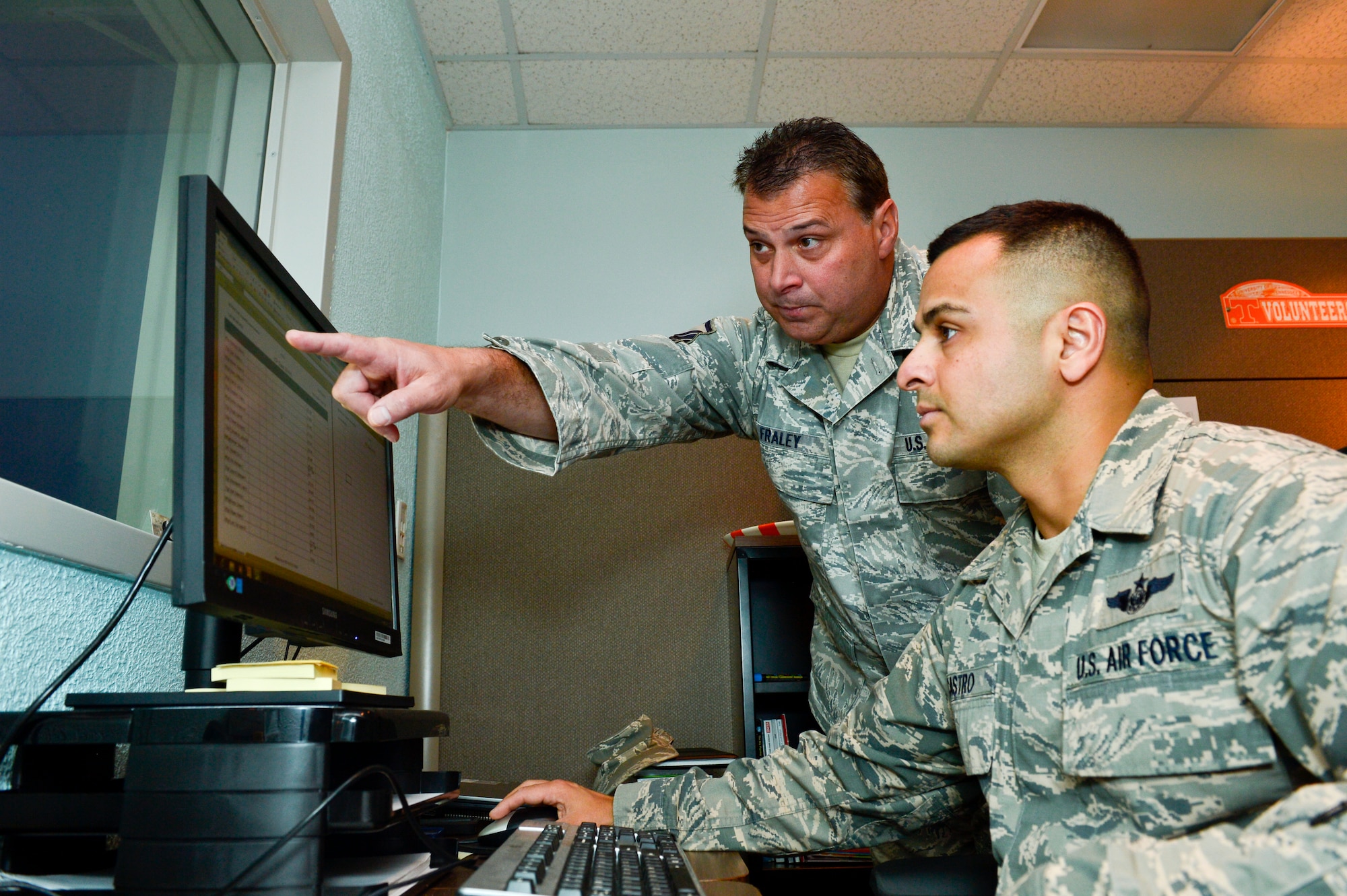 MCGHEE TYSON AIR NATIONAL GUARD BASE, Tenn. -- Master Sgt. Stephen Fraley, left, and Master Sgt. Juan Castro connect the training and education needs of the Air National Guard, government agencies and other services here July 28, 2014, with resources available at the I.G. Brown Training and Education Center. (U.S. Air National Guard photo by Tech. Sgt. Jonathan Young/Released)
