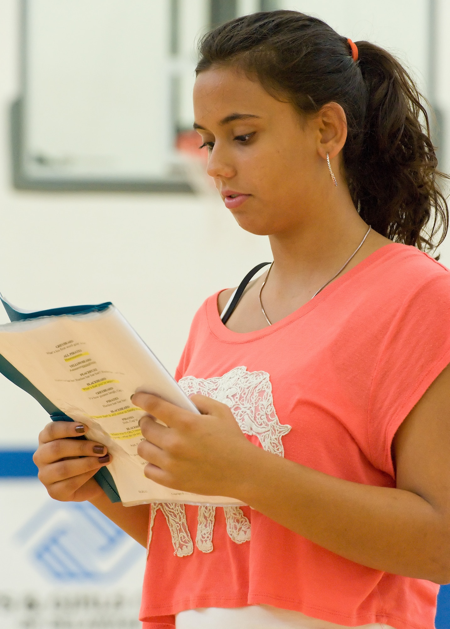 Atanaska Genke, daughter of Chaplain (Capt.) Quentin Genke, 436th Airlift Wing chaplain, studies her lines as Blackbeard Aug. 5, 2014, at the Youth Center on Dover Air Force Base, Del. Genke and 54 other cast members put on an hour-long musical of "Blackbeard the Pirate" at the Dover AFB Youth Center on Aug. 8. (U.S. Air Force photo/Roland Balik)
