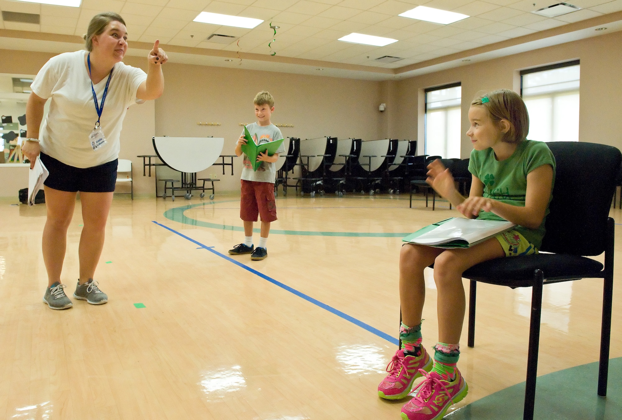 Emilie LaBonte, left, tour actor/director from the Missoula Children's Theatre, Missoula, Montana, rehearses with the crocodiles, Dylan Mills, center, and Ashlynn Phillips, right, during "Blackbeard the Pirate" rehearsals Aug. 5, 2014, at the Youth Center on Dover Air Force Base, Del. Mills is the son of Lt. Col. Jason Mills, 3rd Airlift Squadron commander, and Phillips is the daughter of Lt. Col. Michael Phillips, 436th Mission Support Group deputy commander. (U.S. Air Force photo/Roland Balik)