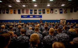 Heisman Trophy winner and former NFL star Herschel Walker shares his story about growing up in Georgia, playing professional football and how he sought help from mental health professionals for his struggles with dissociative identity disorder with Sailors Aug. 6, 2014, at the Joint Base Charleston – Weapons Station, S.C. Walker visited the base to share his story about growing up in Georgia, playing professional football and how he sought help from mental health professionals for his struggles with dissociative identity disorder. Walker spoke and met Sailors and Airmen at both the Weapons Station and Air Base where he met with service members and their families and signed autographs. Walker played college football at the University of Georgia and spent 14 years in the NFL. (U.S. Air Force photo/Senior Airman Tom Brading) 

