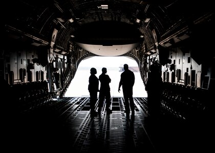 Herschel Walker, former NFL football player and Heisman Trophy winner, experiences life inside the C-17 Globemaster III as part of a base tour in conjunction with his visit Aug. 6, 2014, to Joint Base Charleston, S.C. Walker visited the base to share his story about growing up in Georgia, playing professional football and how he sought help from mental health professionals for his struggles with dissociative identity disorder. Walker spoke and met Sailors and Airmen at both the Weapons Station and Air Base where he met with service members and their families and signed autographs. Walker played college football at the University of Georgia and spent 14 years in the NFL. (U.S. Air Force Photo / Senior Airman Tom Brading)