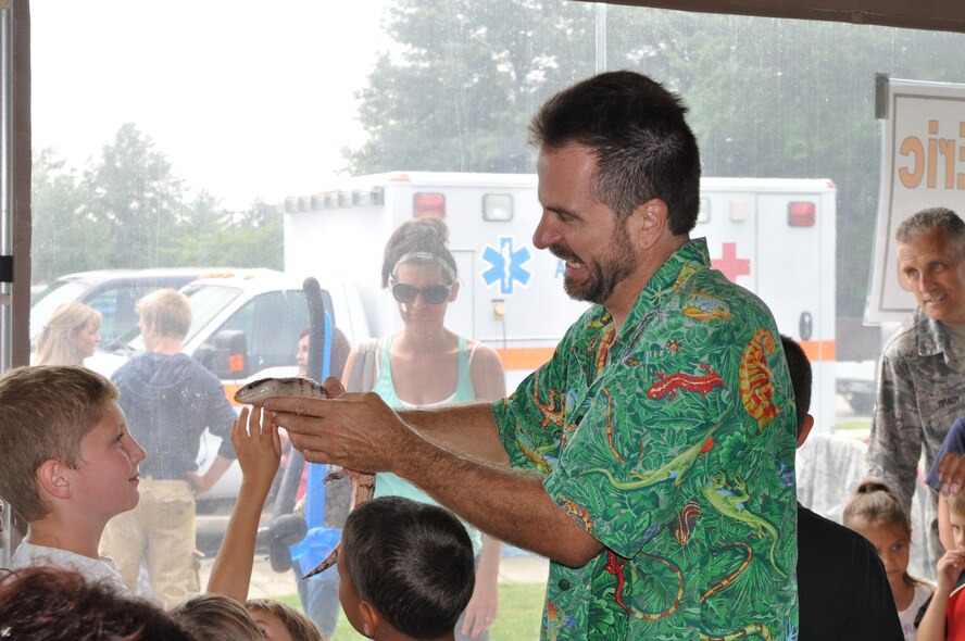 YOUNGSTOWN AIR RESERVE STATION, Ohio – Reptile Eric shows a lizard to a group of children during the Air Force Reserve’s 910th Airlift Wing Family Day held here, August 3, 2014. Family day is an installation open house held for 910th Servicemembers and their families, designed to let Reserve families strengthen bonds and experience the home station of their Reservist loved one. U.S. Air Force photo by Master Sgt. Bob Barko Jr.
