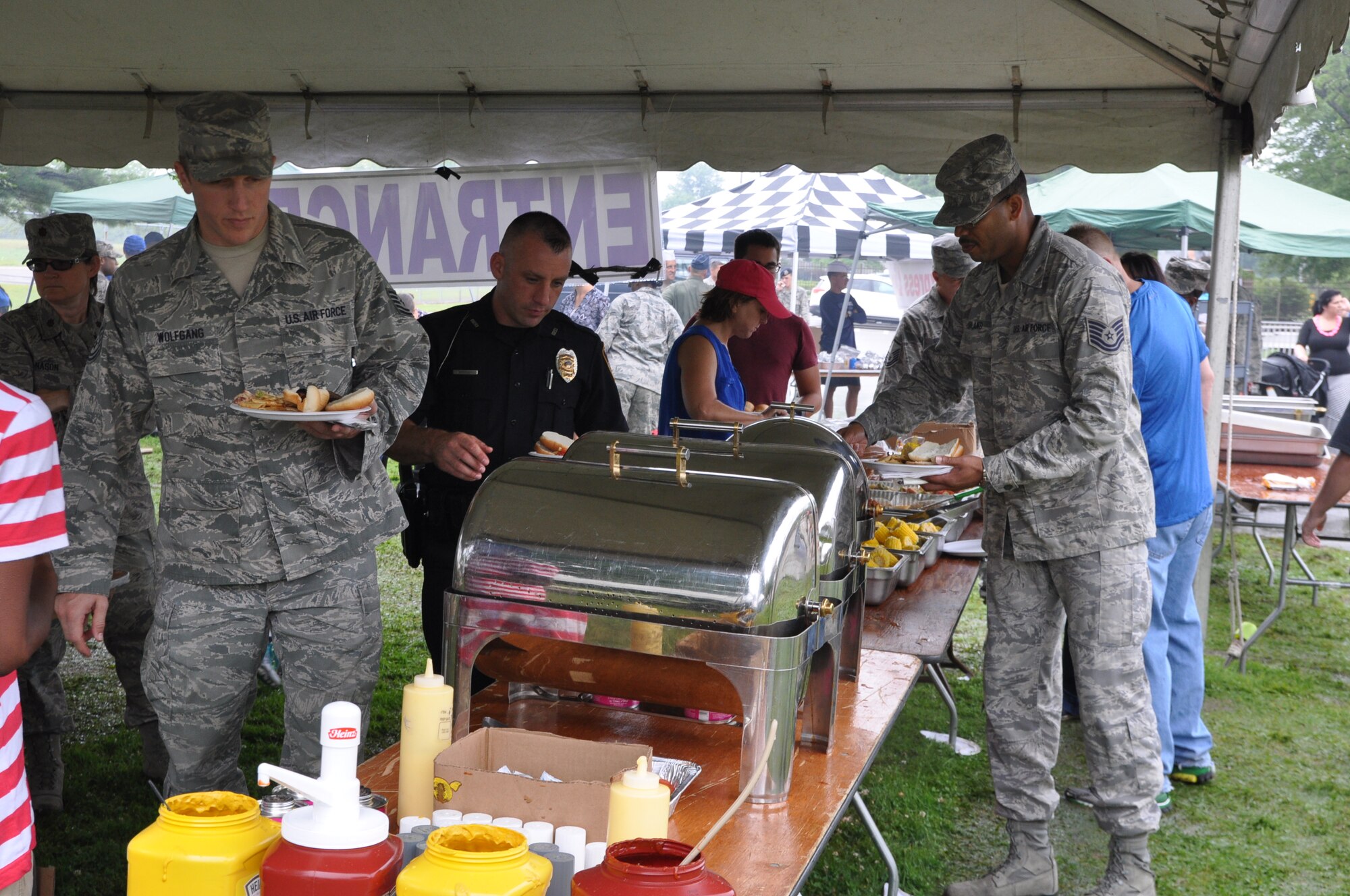 YOUNGSTOWN AIR RESERVE STATION, Ohio – Citizen Airmen assigned to the Air Force Reserve’s 910th Airlift Wing along with family and friends enjoy a picnic lunch served during the wing’s recent Family Day held here, August 3, 2014. Family day is an installation open house held for 910th Servicemembers and their families, designed to let Reserve families strengthen bonds and experience the home station of their Reservist loved one. U.S. Air Force photo by Master Sgt. Bob Barko Jr.
