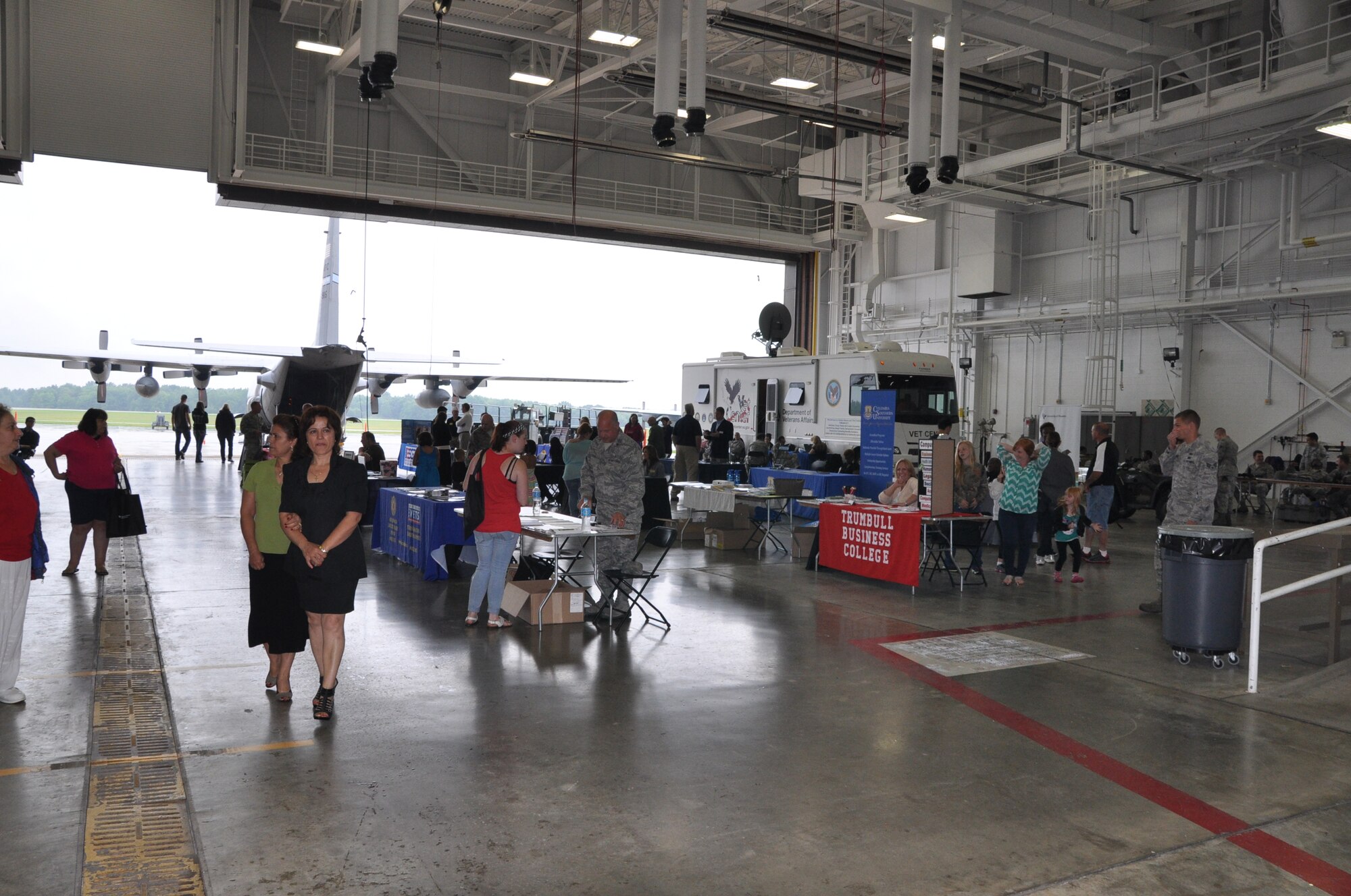 YOUNGSTOWN AIR RESERVE STATION, Ohio – Citizen Airmen assigned to the Air Force Reserve’s 910th Airlift Wing along with family and friends visit booths and other displays at an Education Fair during the wing’s recent Family Day held here, August 3, 2014. Family day is an installation open house held for 910th Servicemembers and their families, designed to let Reserve families strengthen bonds and experience the home station of their Reservist loved one. U.S. Air Force photo by Master Sgt. Bob Barko Jr.