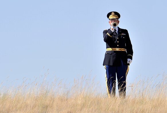 Phil Kowzan plays Taps during the 4th Annual Missing in America Interment Service at the Washington State Veterans Cemetery in Medical Lake, Washington, Aug. 8, 2014. The State Veterans Cemetery opened in 2010 and provides interments for veterans and their spouses. To date, the cemetery has provided a final resting place for over 2,100 veterans and family members. Kowzan is an active volunteer at the cemetery. (U.S. Air Force photo/Senior Airman Mary O'Dell)