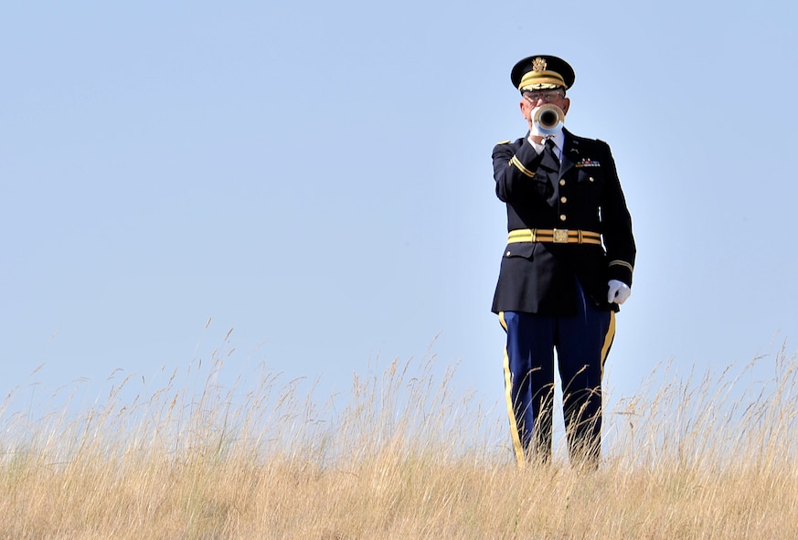Phil Kowzan plays Taps during the 4th Annual Missing in America Interment Service at the Washington State Veterans Cemetery in Medical Lake, Washington, Aug. 8, 2014. The State Veterans Cemetery opened in 2010 and provides interments for veterans and their spouses. To date, the cemetery has provided a final resting place for over 2,100 veterans and family members. Kowzan is an active volunteer at the cemetery. (U.S. Air Force photo/Senior Airman Mary O'Dell)