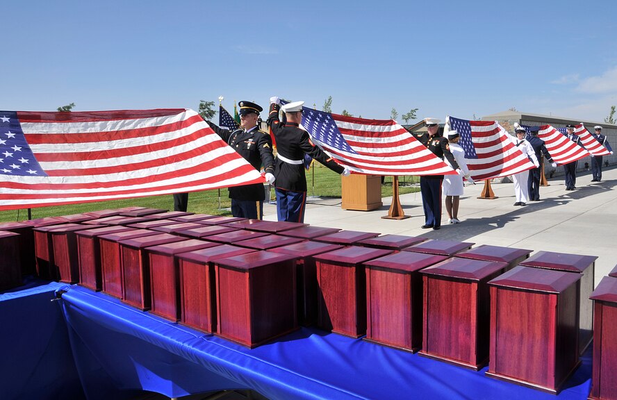 Honor Guard members from each branch of U.S. military service prepare to fold flags prior to the 4th Annual Missing in America Interment Service at the Washington State Veterans Cemetery in Medical Lake, Washington, Aug. 8, 2014. During the ceremony, 44 veterans, unfortunately not claimed by family members, were given a permanent resting place with the help of Patriot Guard Riders, local medical examiners, coroners and funeral homes. (U.S. Air Force photo/Senior Airman Mary O'Dell)