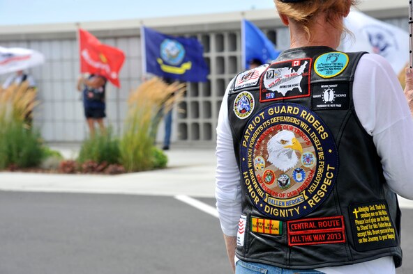 A Patriot Guard Rider stands in formation with fellow riders at the Washington State Veterans Cemetery in Medical Lake, Washington, Aug. 8, 2014. The Patriot Guard is a volunteer, federally registered non-profit organization which ensures dignity and respect at memorial services honoring fallen military heroes, first responders and honorably discharged veterans. (U.S. Air Force photo/Senior Airman Mary O'Dell)