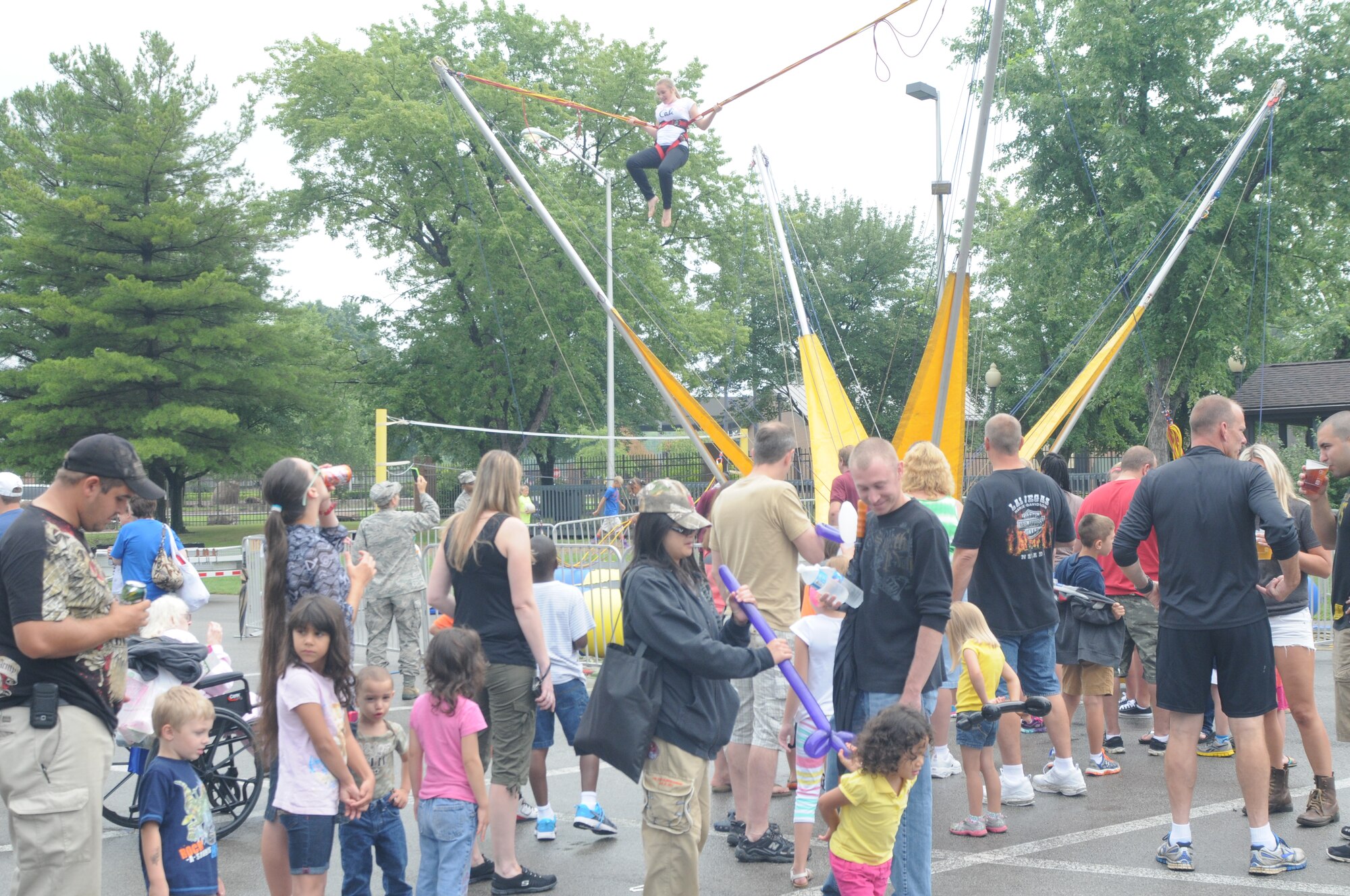 YOUNGSTOWN AIR RESERVE STATION, Ohio – The child of a Citizen Airmen assigned to the Air Force Reserve’s 910th Airlift Wing shows her skills on a trampoline swing during the wing’s recent Family Day held here, August 3, 2014. Family day is an installation open house held for 910th Servicemembers and their families, designed to let Reserve families strengthen bonds and experience the home station of their Reservist loved one. U.S. Air Force photo by Tech. Sgt. Rick Lisum.