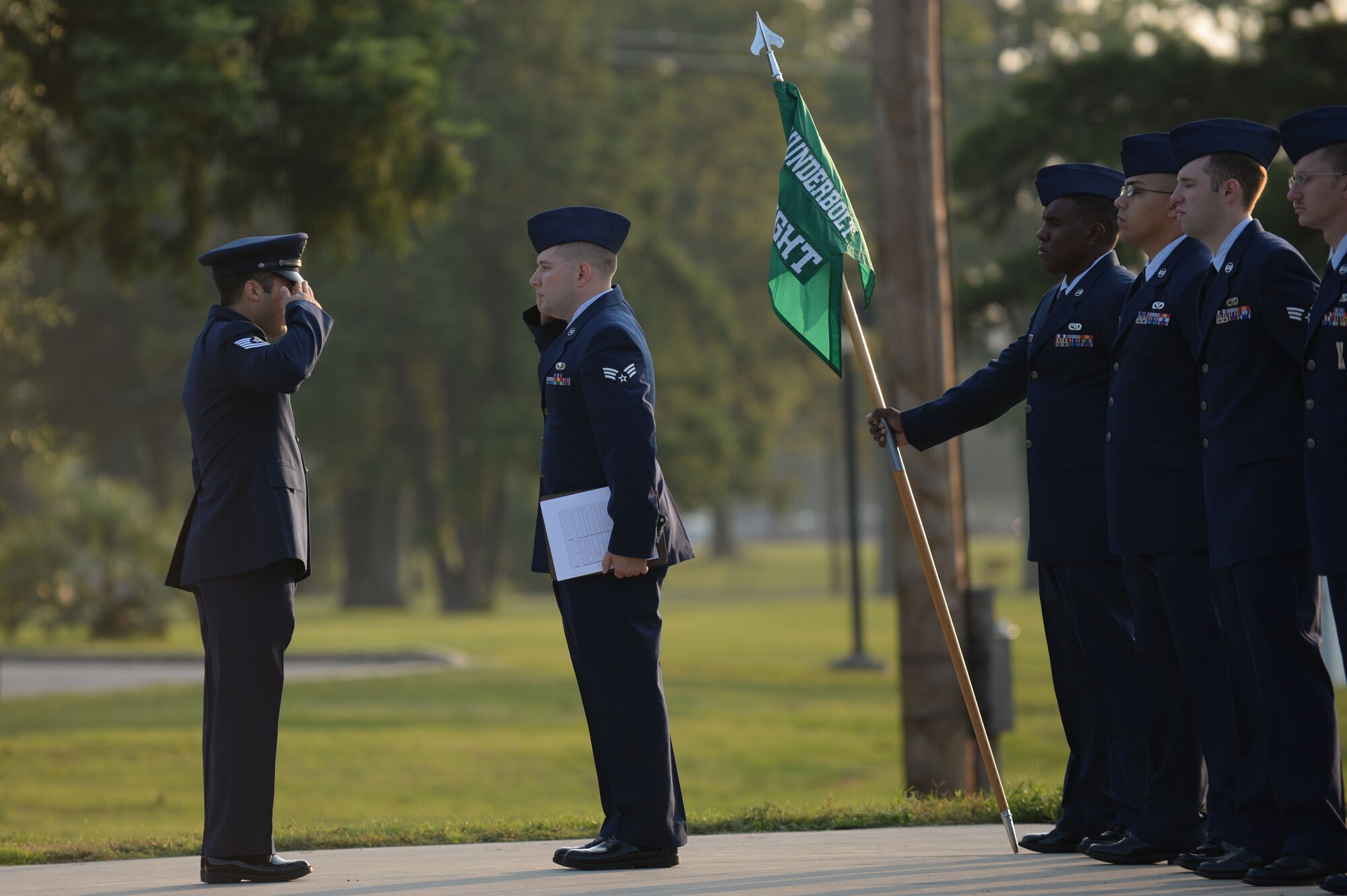 U.S. Air Force Tech. Sgt. Shaun Barlow, 20th Force Support Squadron Airman Leadership School instructor, salutes the Thunderbolt flight class leader after uniform inspections at Shaw Air Force Base, S.C., Aug. 7, 2014. During a uniform inspection, ALS instructors thoroughly inspect Airmen’s uniforms paying specific attention to accouterments such as ribbons, badges, and rank. (U.S. Air Force photo by Airman 1st Class Michael Cossaboom/Released)