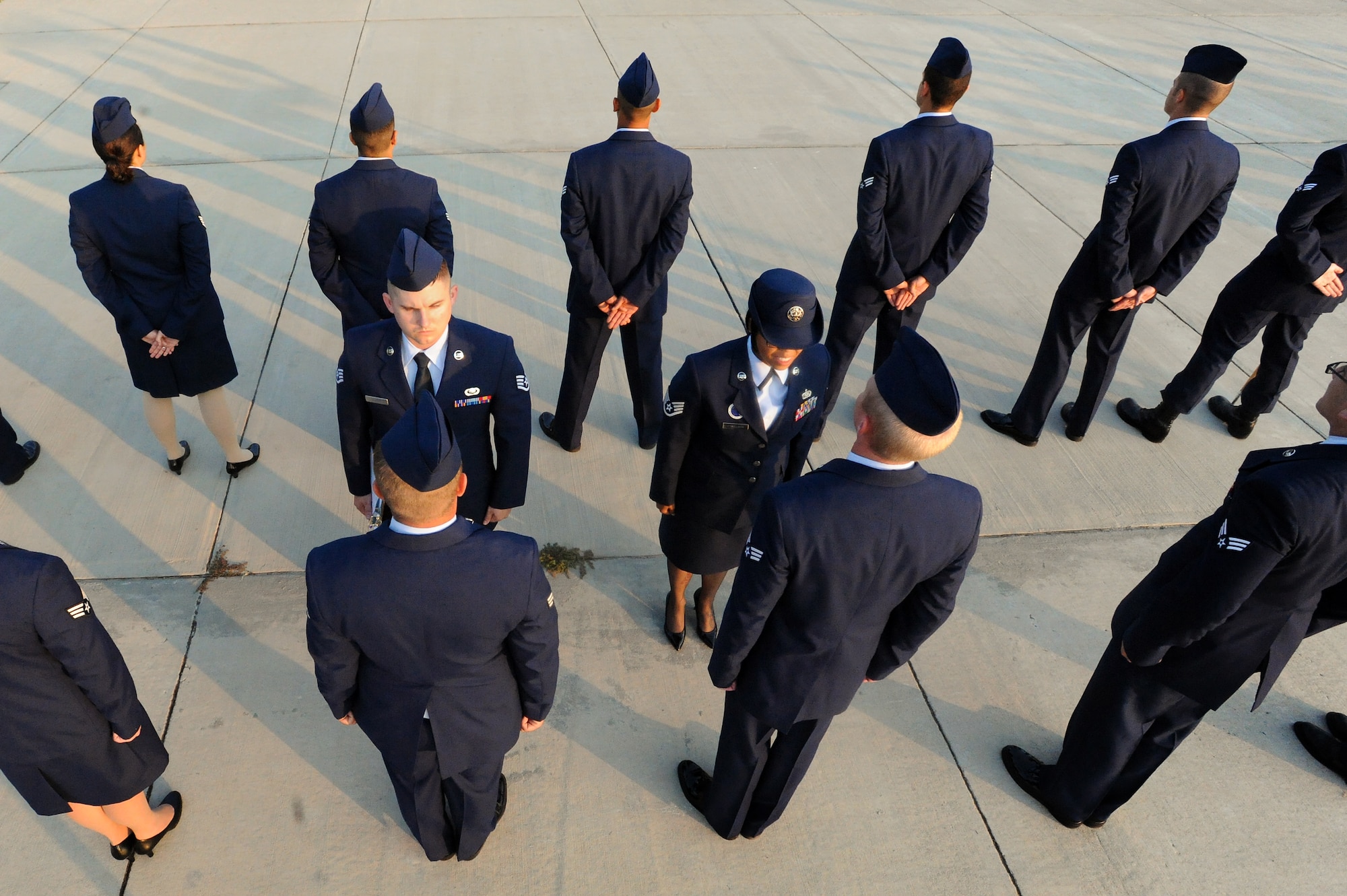 U.S. Air Force Airmen assigned to the Senior Master Sgt. Airman Leadership School class 14-6 get their uniforms inspected by Staff Sgt. Shawnika Danielson, 20th Force Support Squadron Airman Leadership School instructor, at Shaw Air Force Base S.C., Aug. 7, 2014. There are three flights that make up a class, each flight has approximately 16 students. (U.S. Air Force photo by Airman 1st Class Michael Cossaboom/Released) 