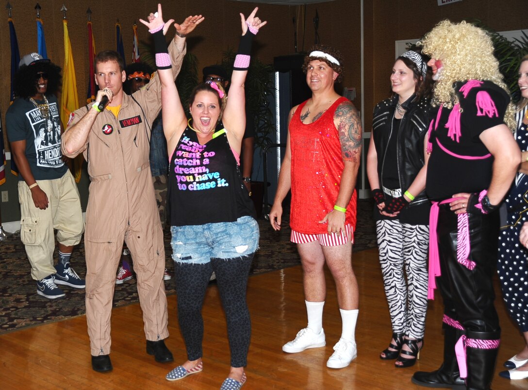 Air Force Birthday Ball Draw Down attendees dressed to this year’s theme “Back to the 80’s” and showcased their best 80’s era attire for the costume contest Aug. 8 at the Columbus Club. The Draw Down is an annual event held by the Air Force Ball Committee to raise money for the Air Force Birthday Ball. The more than 300 attendees enjoyed an open food and refreshments buffet as well as a costume contest where the winner was decided by the volume of the crowd’s applause. Ticket holders were placed in a raffle where over $8,000 worth of prizes were distributed, including $5,000, a 48’ TV, numerous gift cards and other prizes.(U.S. Air Force photo/ Airman John Day)