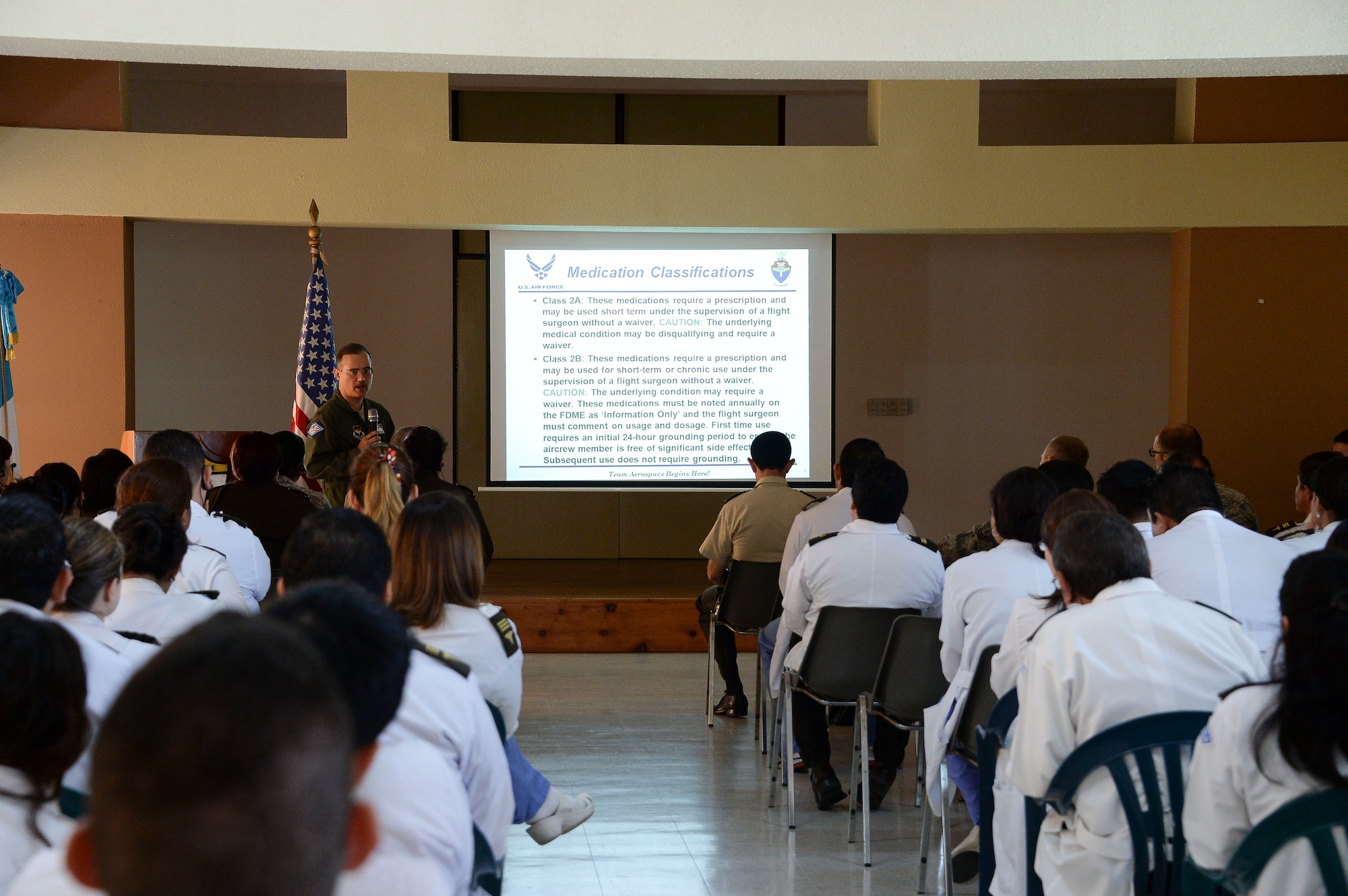 Lt. Col. Eric Burdge, Air Surgeon for the Arkansas Air National Guard, briefs a group of Guatemalan army medical professional on the important role of the flight air surgeon and how his role ensures the safety of the aircraft and crew in Guatemala City, Guatemala, Aug. 7, 2014.  Airmen from AFOUTH along with National Guard Airmen from the 189th Airlift Wing in Arkansas participated in the exchange, which focused on establishing a variety of medical programs.  (U.S. Air Force photo by Tech. Sgt. Heather R. Redman/Released)