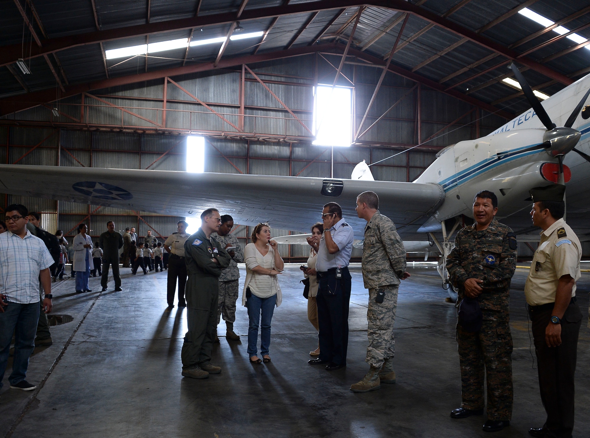 Col. Luis Salazar, Guatemalan air force Hospilito director, shows members of 12th Air Force (Air Forces Southern) and the Arkansas Air National Guard the Guatemalan’s Basler BT-67, which is used for patient transport, as part of a tour of the Guatemalan air force base during a subject matter expert exchange with the Guatemalan Military in Guatemala City, Guatemala, Aug. 6, 2014.  The tour informed the U.S. medical technicians of the capabilities of the Guatemalan air force. (U.S. Air Force photo by Tech. Sgt. Heather R. Redman/Released)