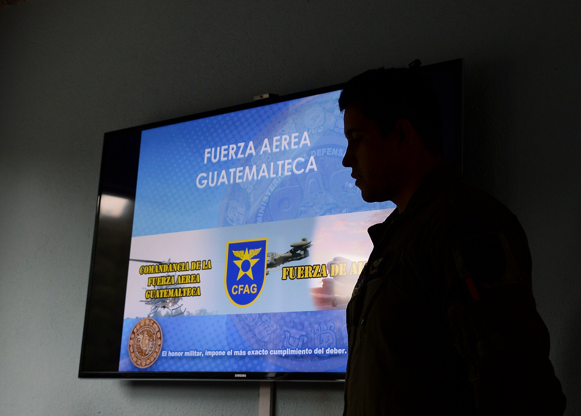 Lt. 1st Class Alejandro Godoy, pilot with the Guatemalan air force, briefs members of 12th Air Force (Air Forces Southern) and the Arkansas Air National Guard on Guatemalan aircraft during a subject matter expert exchange with the Guatemalan Military in Guatemala City, Guatemala, Aug. 5, 2014.  The briefing was used to inform the U.S. medical technicians of the Guatemalan air force’s aerospace medical capabilities. (U.S. Air Force photo by Tech. Sgt. Heather R. Redman/Released)