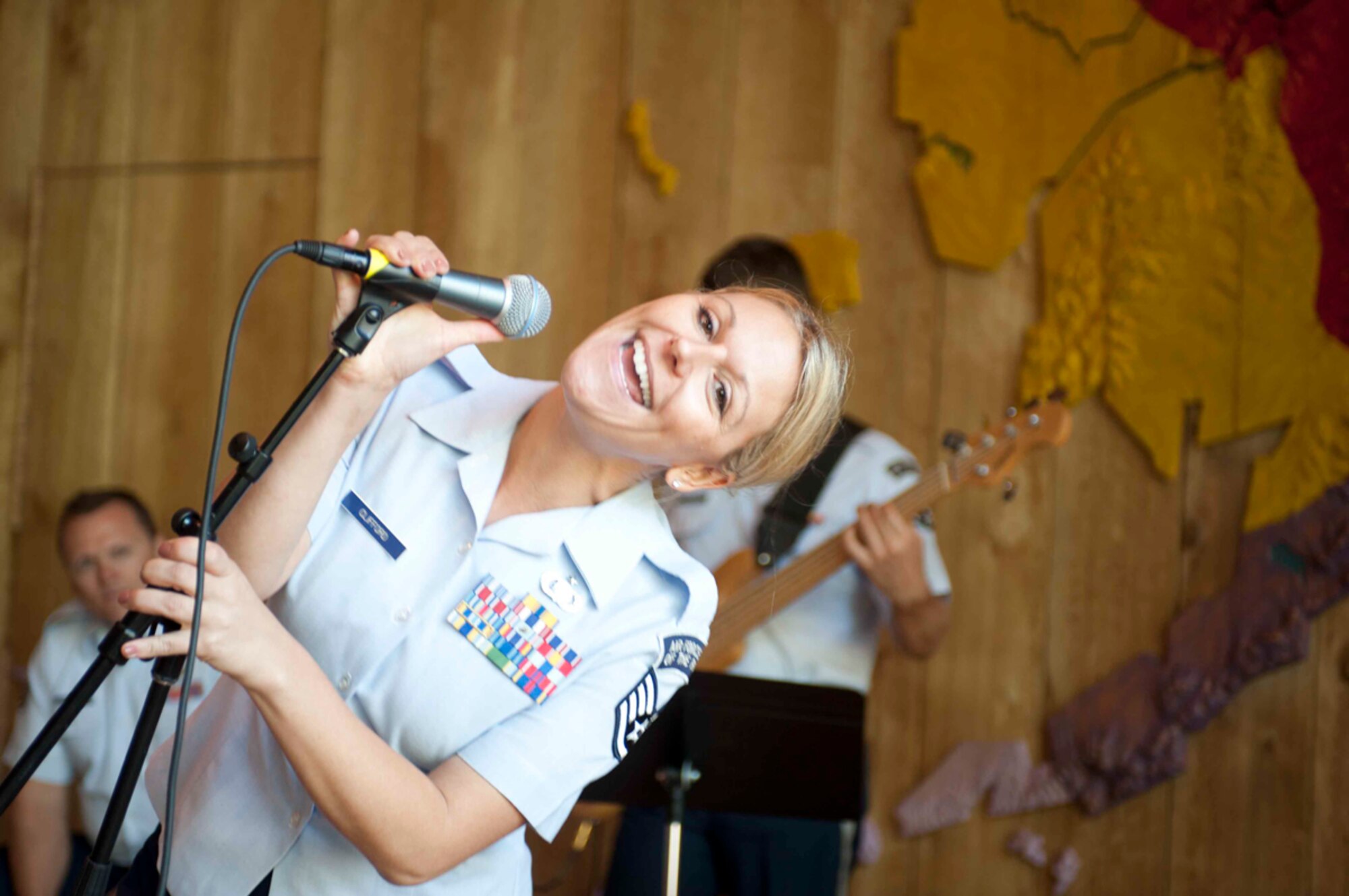The Band of the Pacific performed at the Alaska Native Heritage Center July 30, 2014. The Air Force Band of the Pacific left JBER last year and moved to Hawaii, but their enduring popularity made a week-long return with several stops a hit with Alaskans. The Airmen performed in downtown Anchorage's Friday0night live music lineup and at the Loussac Library, as well as at the Arctic Thunder Open House and in Talkeetna. (U.S. Air Force photo illustration/Staff Sgt. Robert Barnett and Staff Sgt. William Banton)