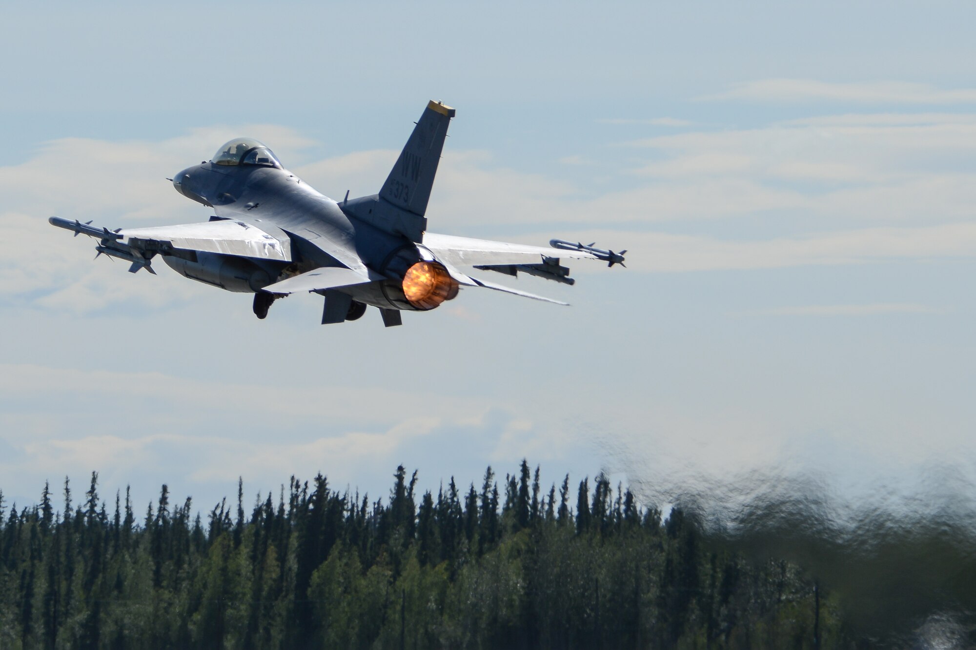 A U.S. Air Force F-16 Fighting Falcon assigned to the 14th Fighter Squadron, Misawa Air Base, Japan, launches during RED FLAG-Alaska 14-3 Aug. 8, 2014, Eielson Air Force Base, Alaska. The F-16 is a compact, highly maneuverable fighter aircraft, vastly proven in air-to-air combat and air-to-surface attack. (U.S. Air Force photo by Tech. Sgt. Joseph Swafford Jr./Released)
