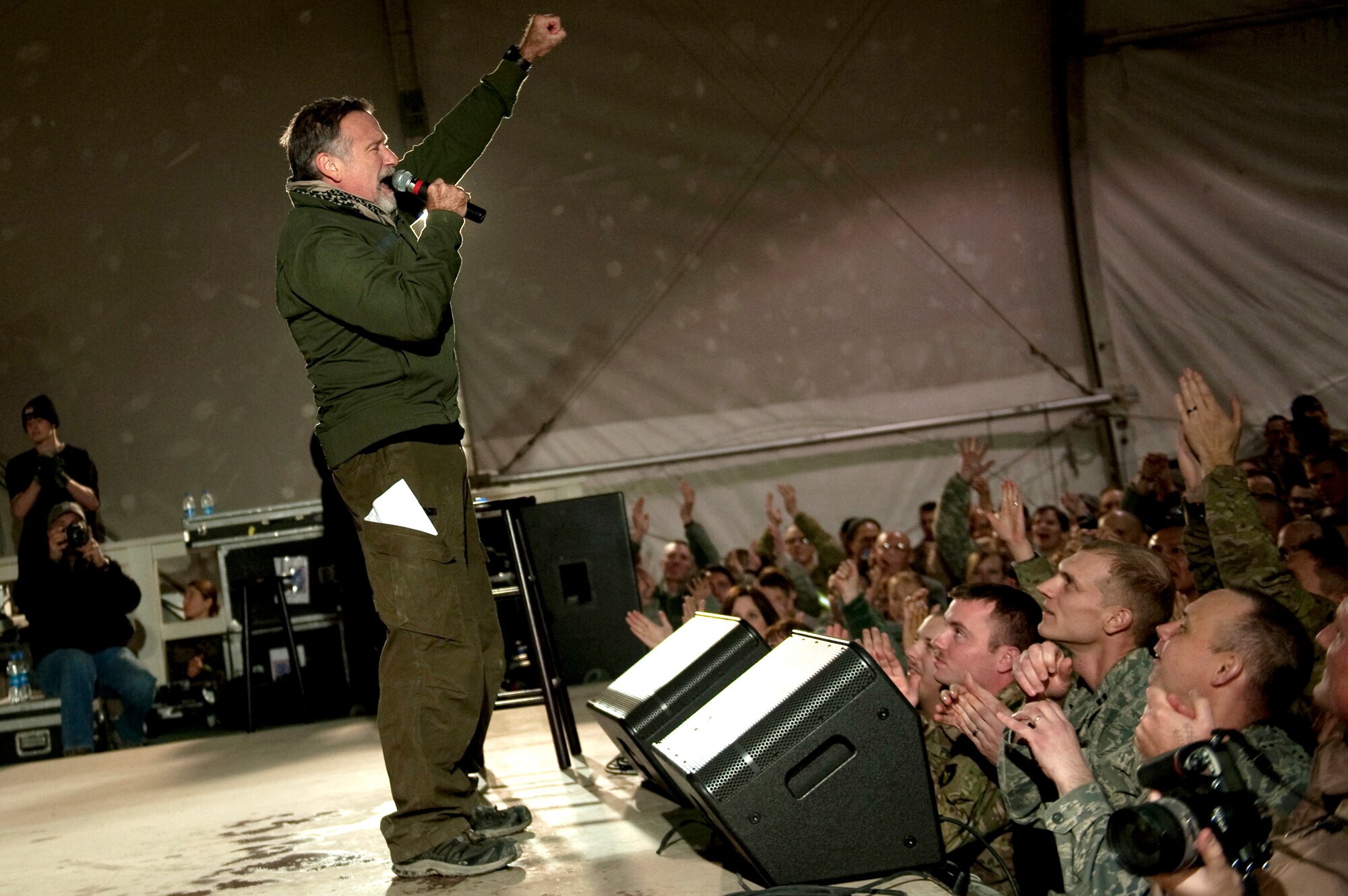 Comedian Robin Williams performs during the USO holiday tour on Bagram Airfield, Afghanistan, Dec.15, 2010. Defense Secretary Chuck Hagel saluted actor and comedian Robin Williams, who’d passed away yesterday at age 63, for his steadfast support of U.S. troops and veterans over the years.  (DOD photo by U.S. Navy Petty Officer 1st Class Chad J. McNeeley)