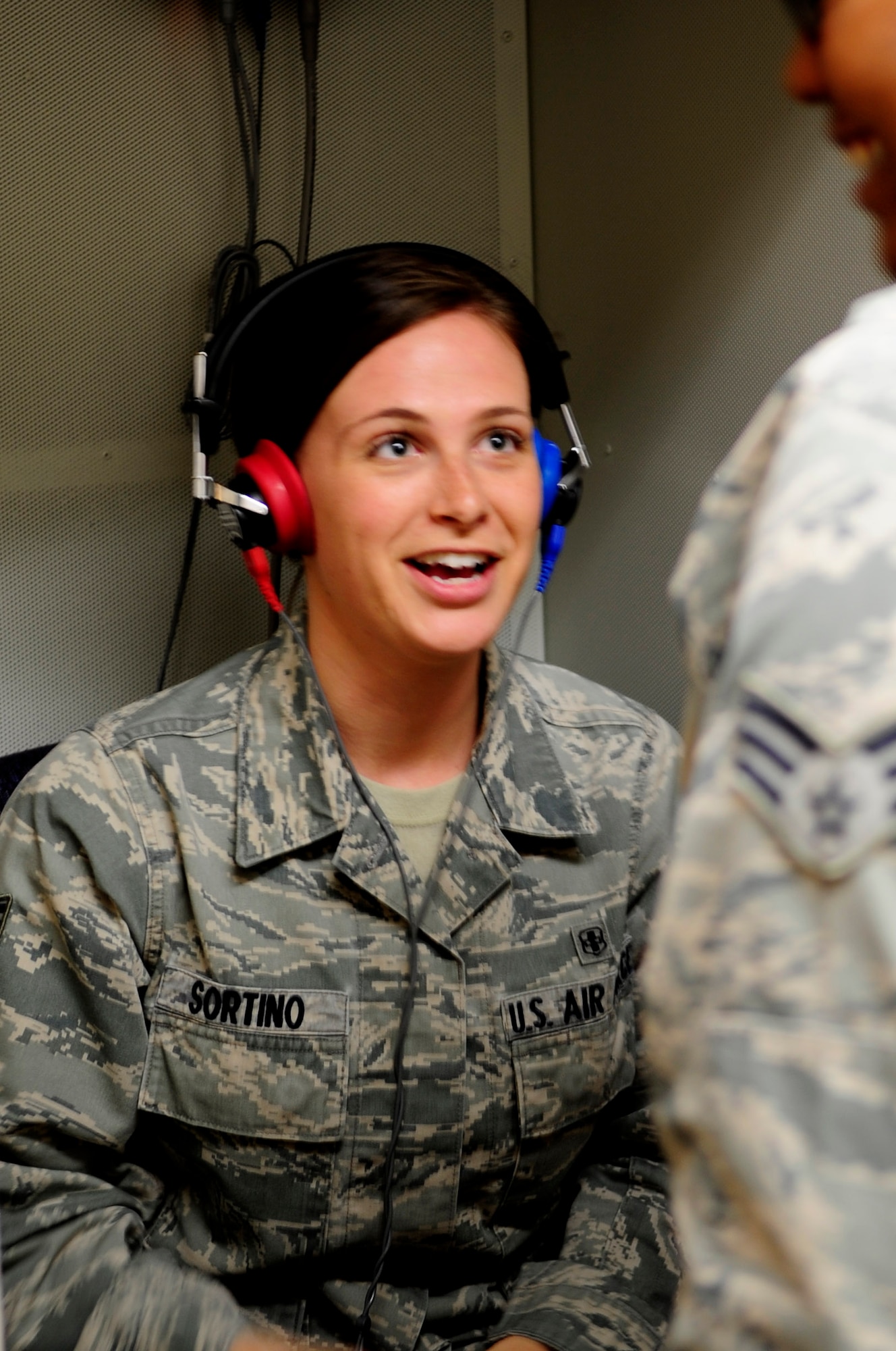 Senior Airmen Madasen Sortino and Lakeya Jones, 30th Medical Operations Squadron public health technicians, simulate a hearing test, Aug. 5, 2014, Vandenberg Air Force Base, Calif. From conducting hearing tests, to ensuring members are medically cleared to deploy, to monitoring a variety of potential hazards around base, members of public health pride themselves in providing a variety of healthcare services. (U.S. Air Force photo by Airman 1st Class Ian Dudley/Released)
