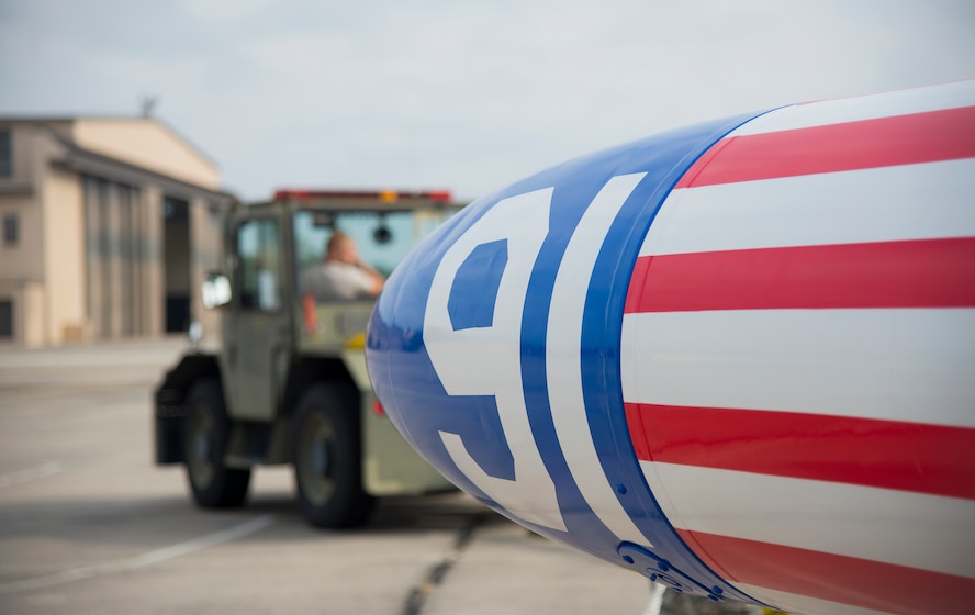 An Airman tows a newly painted T-33 Shooting Star to the flightline at Moody Air Force Base, Ga., Aug. 1, 2014. The T-33 is a support aircraft and was used for training here from December 1957 to November 1960. (U.S. Air Force photo by Airman 1st Class Sandra Marrero/Released)
