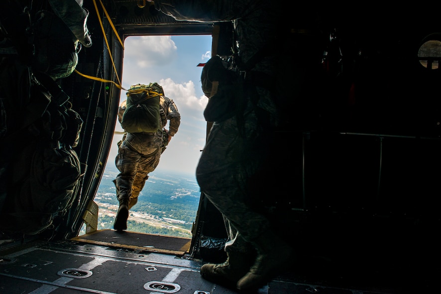 An Airman from the 820th Base Defense Group jumps from an HC-130P Combat King into the skies over Tifton, Ga., Aug. 7, 2014. 820th BDG “Defenders” jump often to maintain their qualifications. (U.S. Air Force photo by Airman 1st Class Ryan Callaghan/Released)