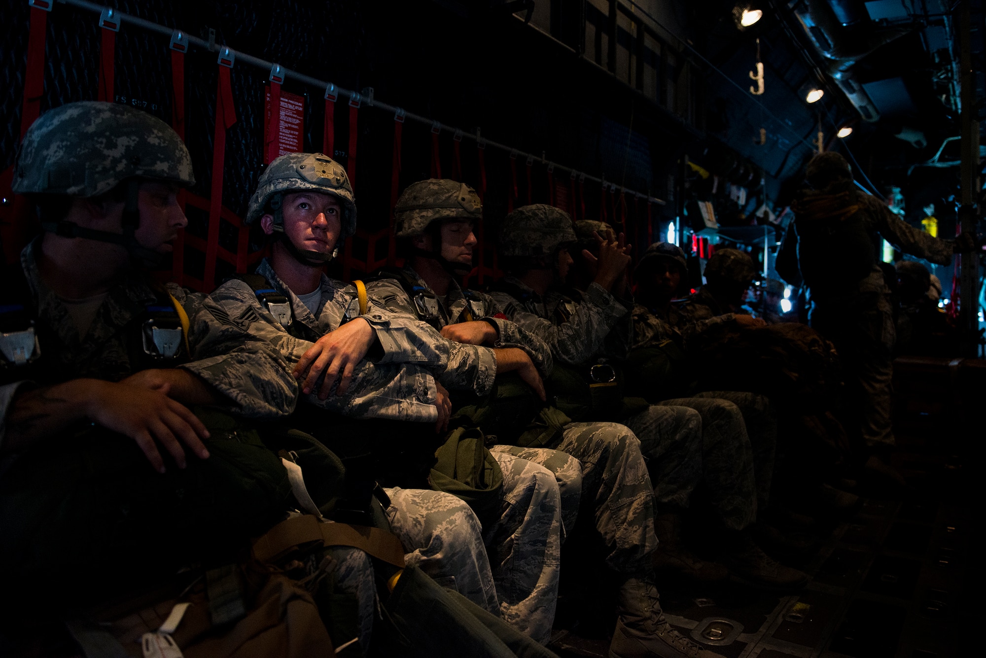 Airmen from the 820th Base Defense Group wait for a static-line jump over Tifton, Ga., Aug. 7, 2014. The 820th BDG is the expeditionary Air Force's only worldwide deployable, first-in, self-sustaining force protection capability. (U.S. Air Force photo by Airman 1st Class Ryan Callaghan/Released)