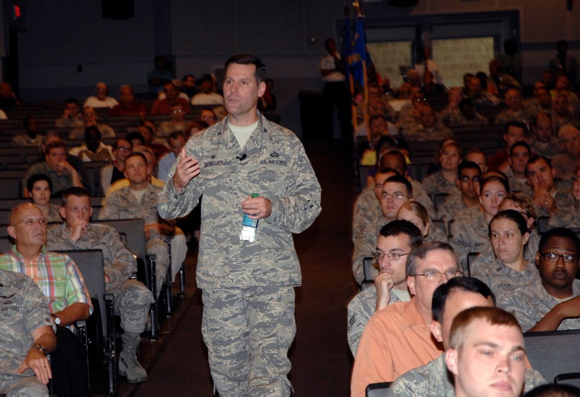 Col. John Devillier, 88th Air Base Wing commander, discusses his priorities during one of his intial commander's calls in the base theater on July 31. (Air Force photo by Al Bright)