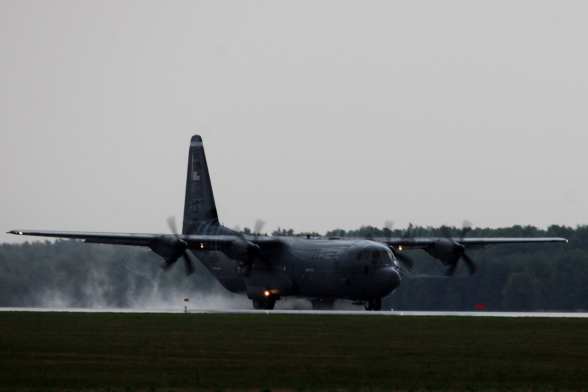 A C-130J Super Hercules touches down before immediately taking off again during a training flight, in support of Operation Atlantic Resolve, at Powidz Air Base, Poland, Aug. 11, 2014. Operation Atlantic Resolve is a bilateral commitment by the United States to work with NATO partners toward a peaceful and stable Europe. (U.S. Air Force photo by Staff Sgt. Jarad A. Denton/Released)