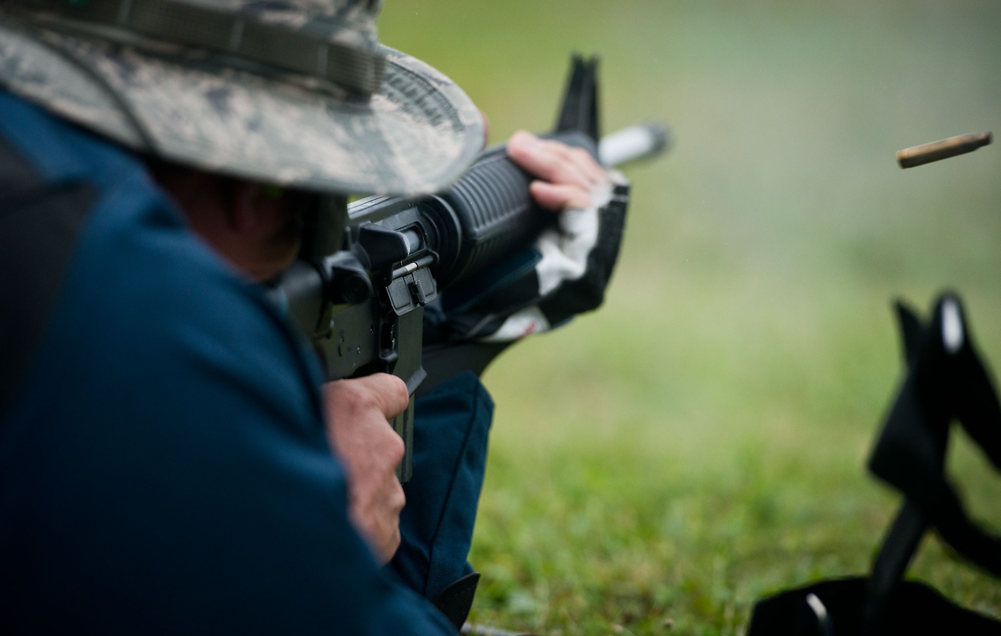 Special Agent David Ohlinger fires one of 10 shots during a 10-minute slow-fire round at 300 yards. Shooters fire at targets from several postures at ranges of 200, 300 and 600 yards, all open sights. The combination of ranges and postures vary day to day and event to event. (U.S. Air Force photo/Staff Sgt. Andrew Lee)

