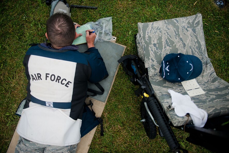 Special Agent David Ohlinger fills out a scorecard after completing a round of firing during a rifle competition at Camp Perry, Ohio. Ohlinger and three other members of the Air Force Shooting Team competed in the annual Civilian Marksmanship Program rifle competitions in Camp Perry, Ohio. (U.S. Air Force photo/Staff Sgt. Andrew Lee)