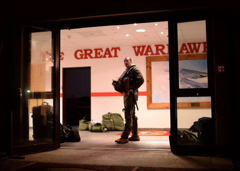 U.S Air Force Capt. Taylor Blevins, a U.S. Air Force F-16 Fighting Falcon fighter aircraft pilot from the 480th Fighter Squadron at Spangdahlem Air Base, Germany, paces the lobby of the squadron Aug. 8, 2014, prior to leaving for a training event between the U.S. and Hellenic air forces in Souda Bay, Greece, Aug. 11-23. The pilots' presence in Europe affords the U.S. Air Force an opportunity to train with NATO allies to strengthen military ties and ensure regional peace and stability. (U.S. Air Force photo by Staff Sgt. Daryl Knee/Released)