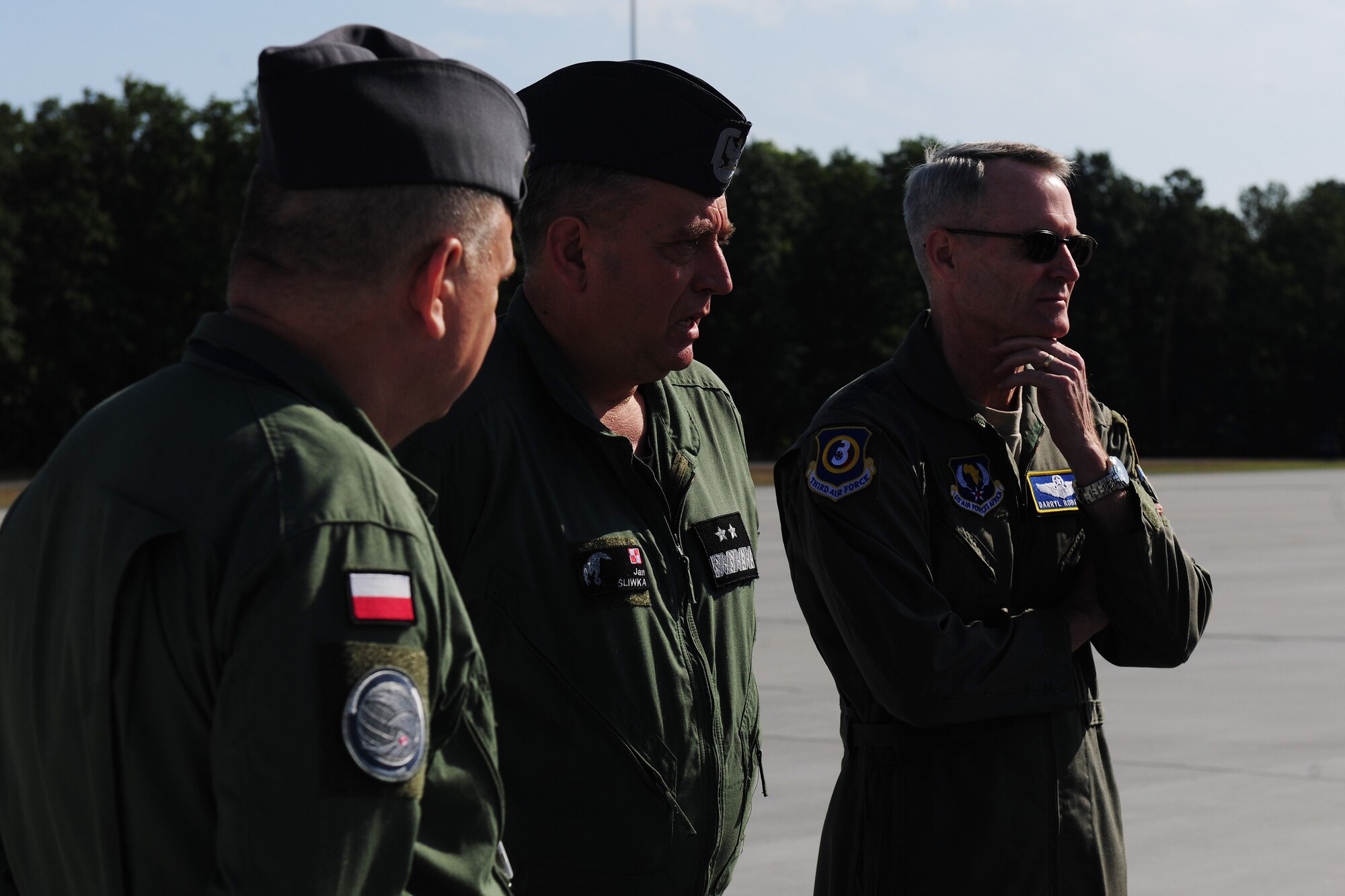 U.S. Air Force Lt. Gen. Darryl Roberson, 3rd Air Force commander, speaks with Polish Air Force, 33rd Transportation Air Base leadership at Powidz Air Base, Poland, Aug. 12, 2014. Roberson was able to assess the bilateral training operations conducted by United States and Polish Service members in support of Operation Atlantic Resolve. (U.S. Air Force photo by Staff Sgt. Jarad A. Denton/Released)