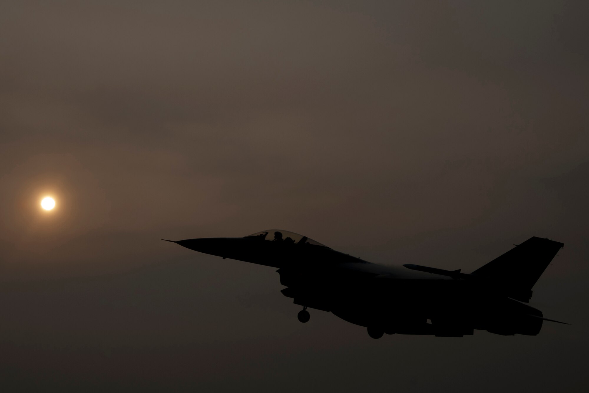 An F-16 Fighting Falcon departs from Kunsan Air Base, Republic of Korea, to attend RED FLAG-Alaska 14-3, Aug. 12, 2014.  The exercise provides unique opportunities to integrate various forces into joint, coalition and multilateral training from simulated forward-operating bases. (U.S. Air Force photo by Senior Airman Taylor Curry/Released)