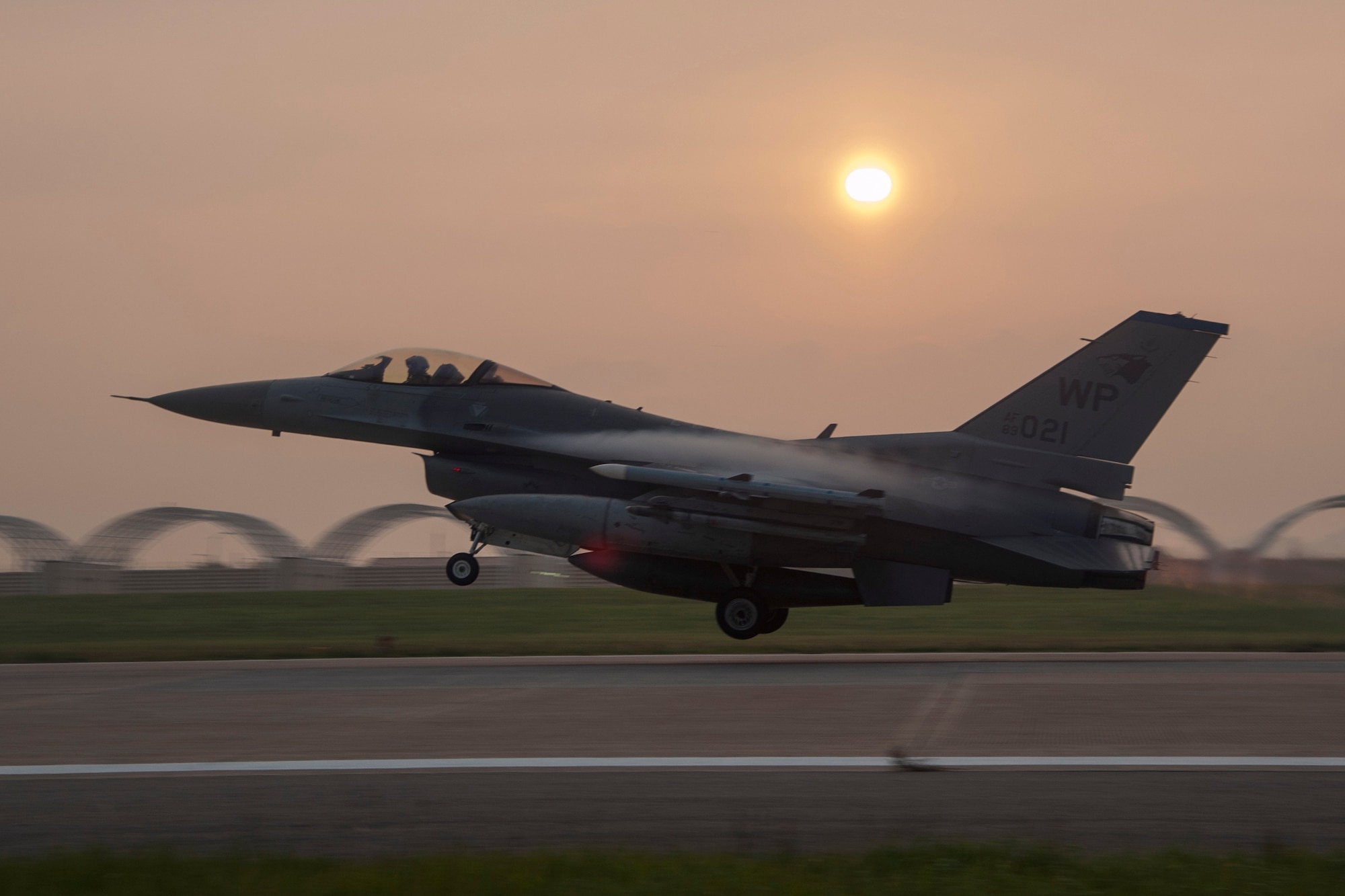 An F-16 Fighting Falcon departs from Kunsan Air Base, Republic of Korea, to attend RED FLAG-Alaska 14-3, Aug. 12, 2014. Conducting RED FLAG training in Alaska allows Wolf Pack Airmen to exchange tactics, techniques and procedures while improving interoperability with other flying units, including Republic of Korea Air Force airmen.  (U.S. Air Force photo by Senior Airman Taylor Curry/Released)